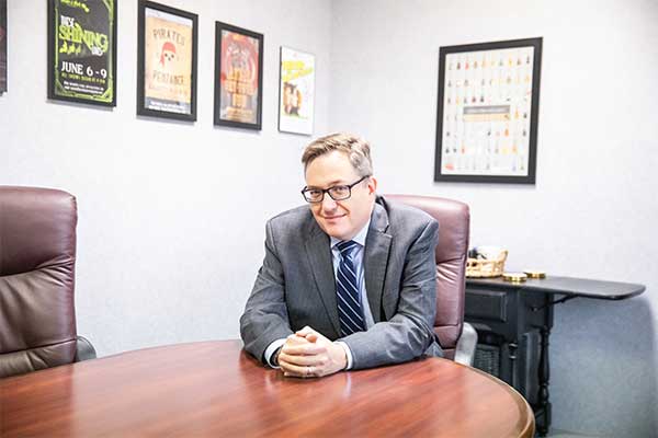 photo of attorney Rick Stewart at desk
